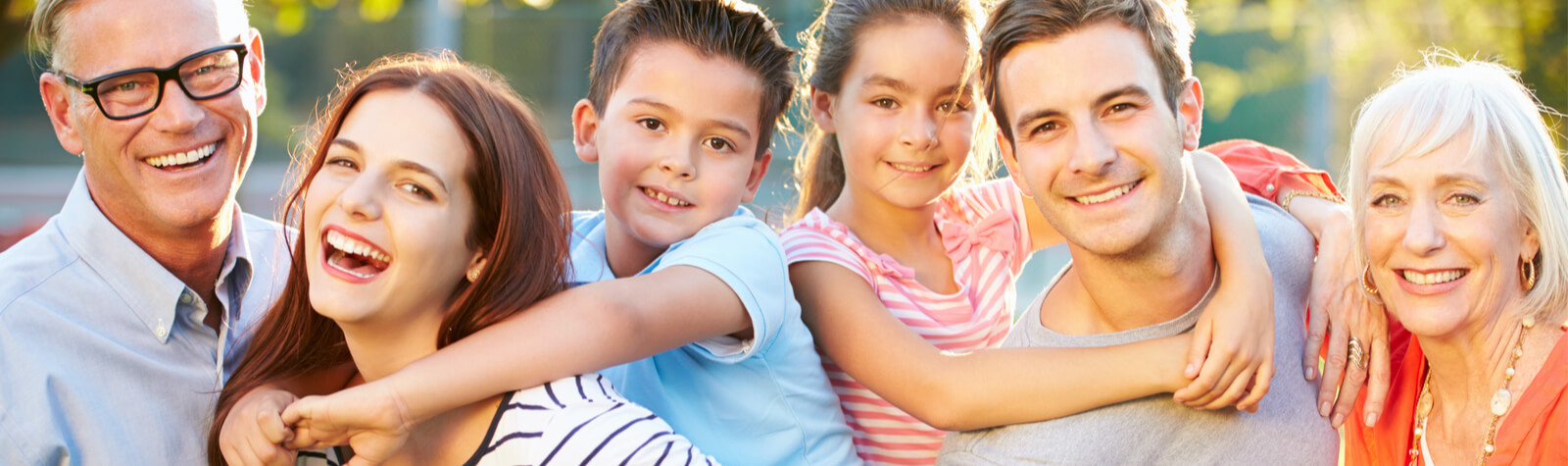 Smiling multigenerational family outdoors
