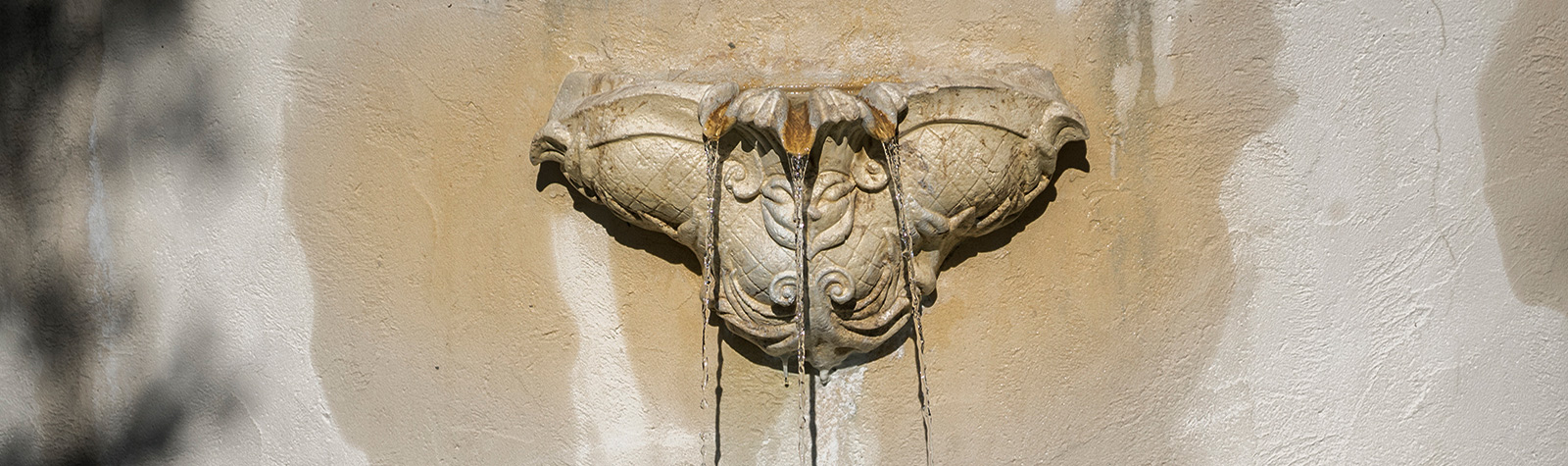 fountain with water spilling out of it